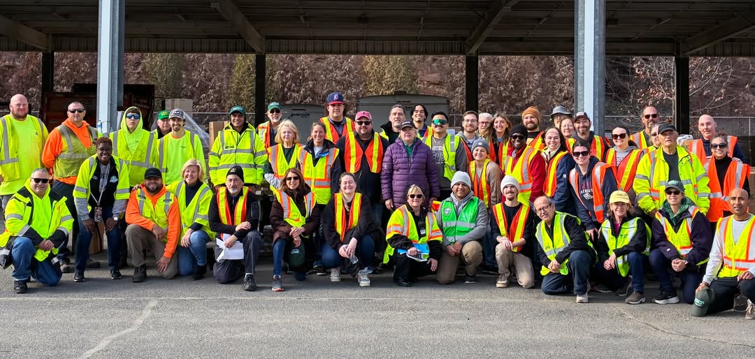 workers posing for a picture